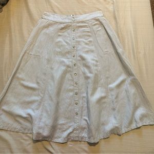 Buttoned down blue skirt. Size 4